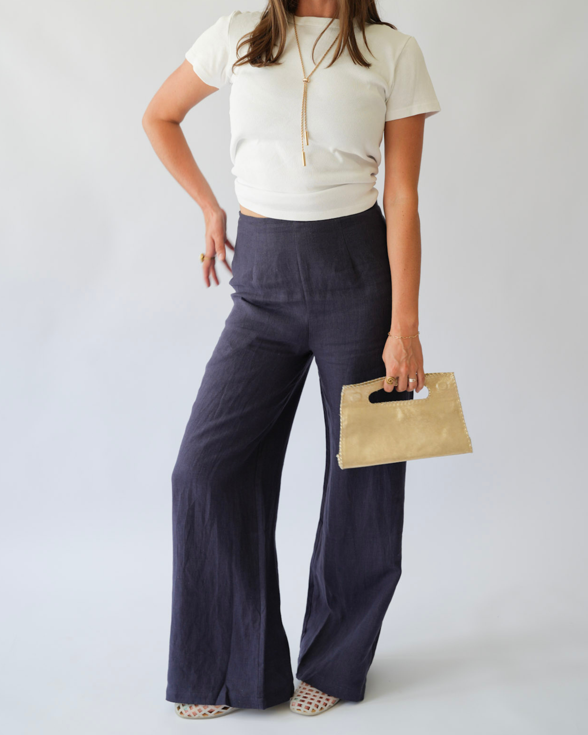 Girl holding a gold clutch