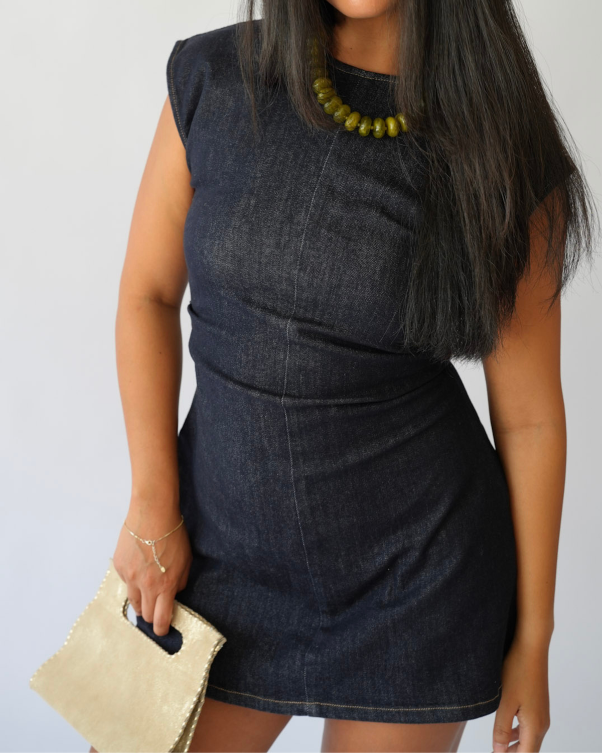 GIrl in dark demin mini dress 
